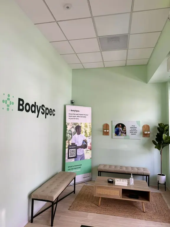 Waiting area with benches and BodySpec banner at BodySpec SF Marina