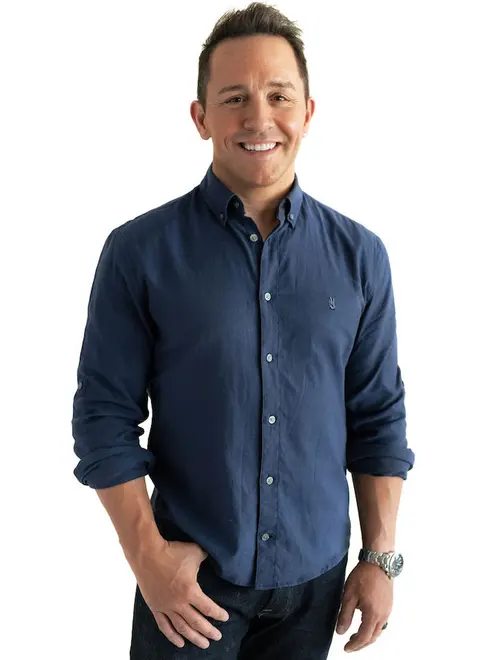 Portrait of Dr. Steven Conroy, founder of Boost Performance and Longevity Center, in a navy button-down shirt
