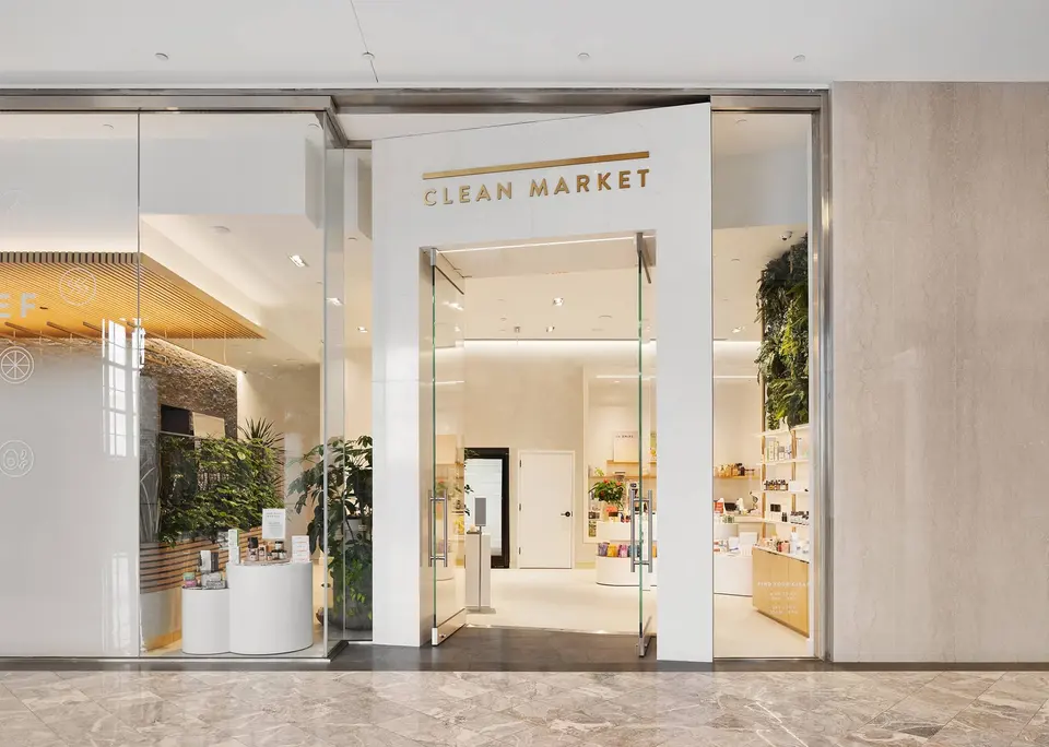 Clean Market storefront with glass entrance and gold signage inside Brookfield Place