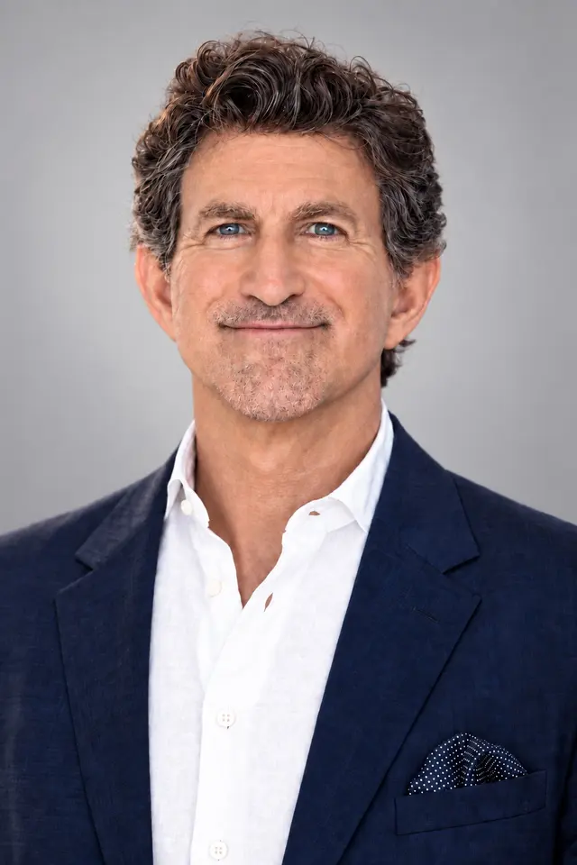 Portrait of founder Dr. Michael Hall in a navy blazer