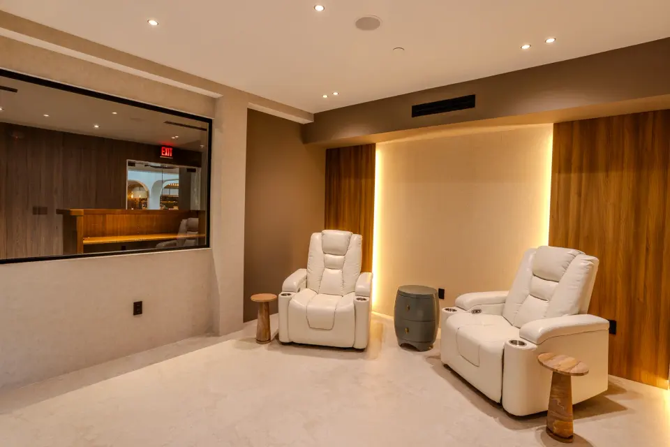 Room with two cream recliners and warm cove lighting at Healthy Longevity Clinic Miami