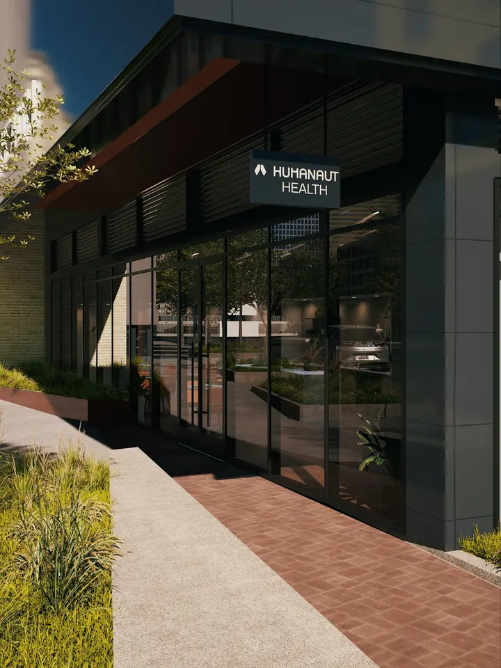 Exterior of Humanaut Health Austin clinic at dusk