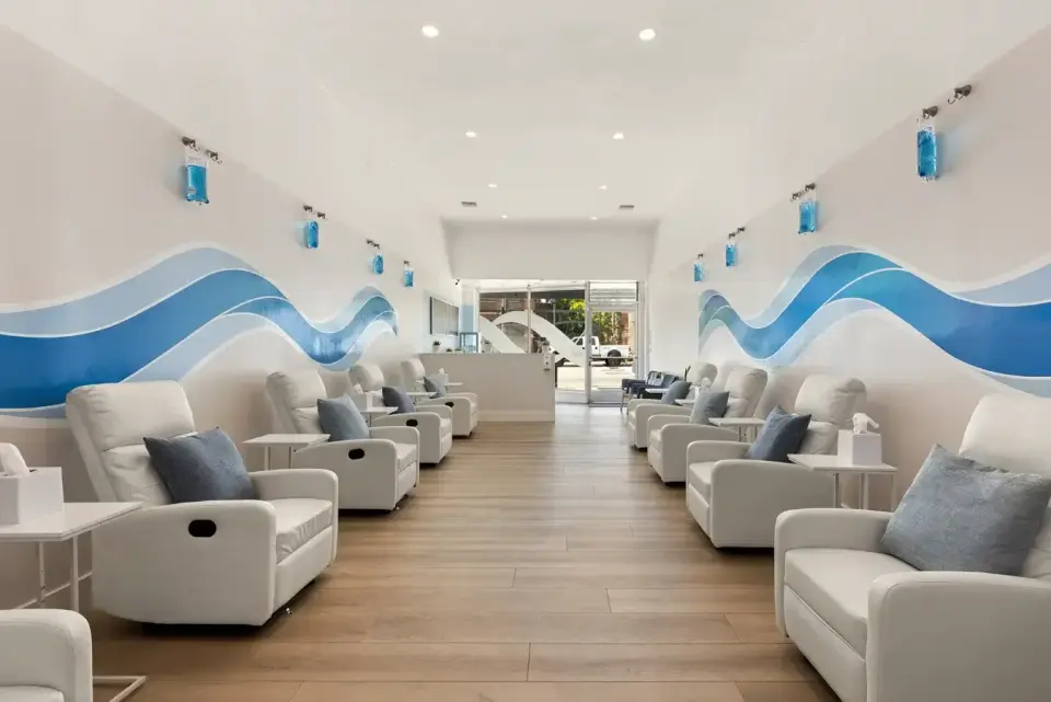 IV lounge with two rows of white recliners at Hydration Room Pasadena