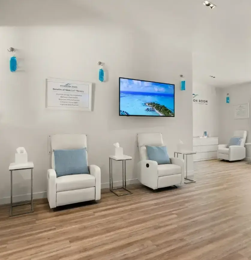 Recliners and wall-mounted TV in the lounge at Hydration Room Studio City