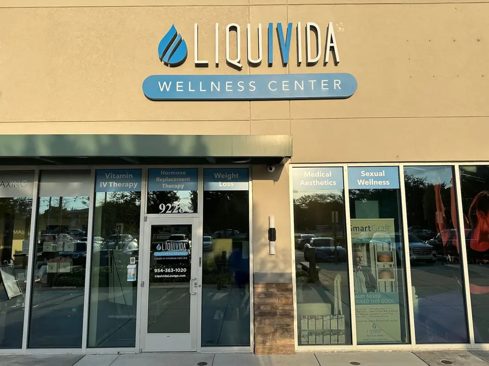 Liquivida Wellness Center storefront with service-listing window decals in Coral Springs