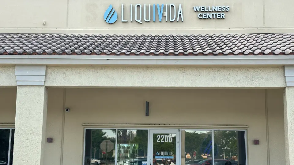 Close view of the Liquivida Wellness Center sign above the Pembroke Pines entrance
