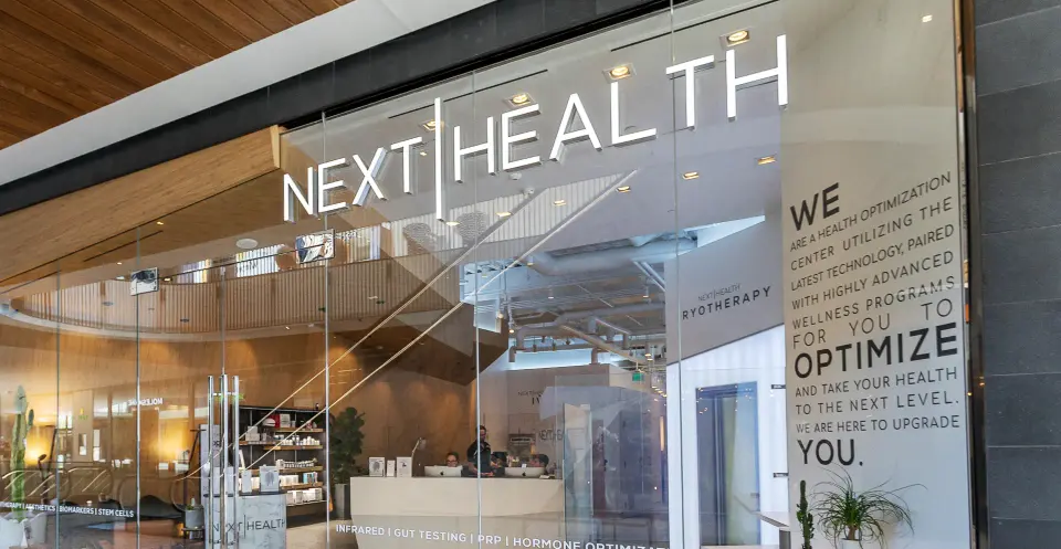 Glass storefront with Next Health signage at Century City