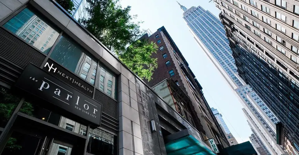 Next Health signage on 'The Parlor' building, looking up toward the Empire State Building
