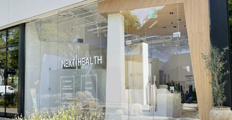 Glass storefront with Next Health signage in Studio City