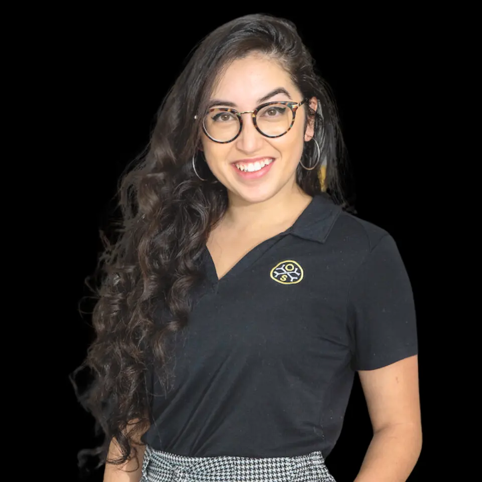 Portrait of Jacqueline, a team member at OsteoStrong Colleyville East, in a branded black polo