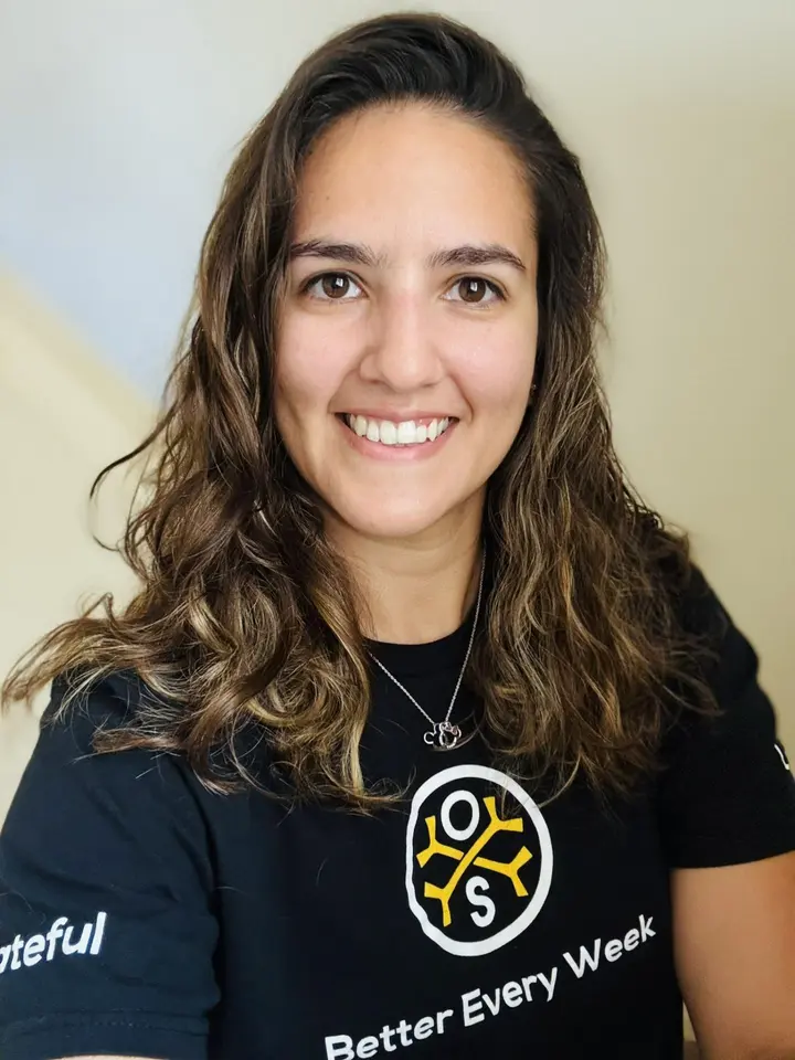 Portrait of Heather Clemons, OsteoStrong regional manager for the Austin and Georgetown centers, in an OsteoStrong T-shirt