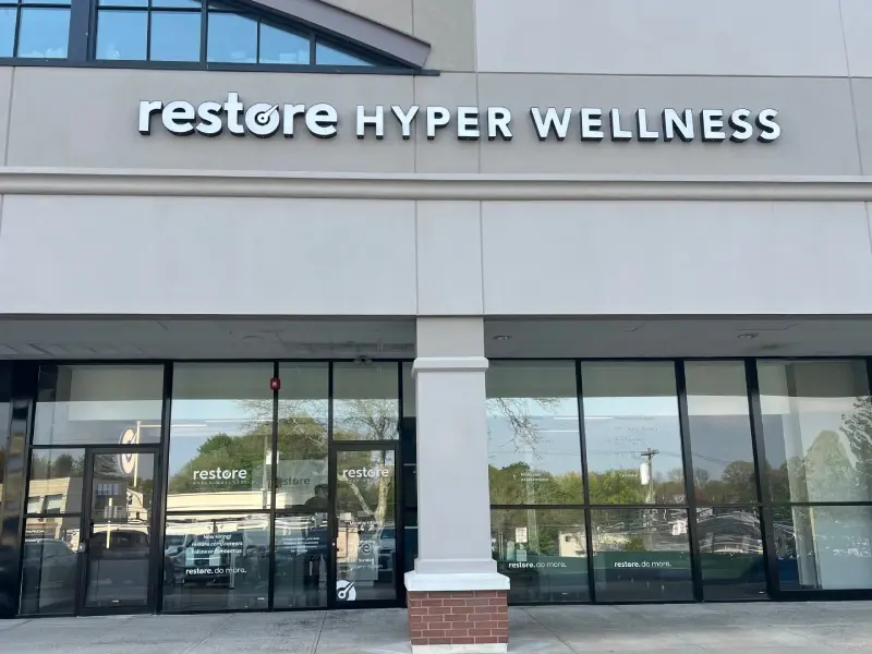 Restore Hyper Wellness storefront sign above glass windows in Eastchester/Scarsdale