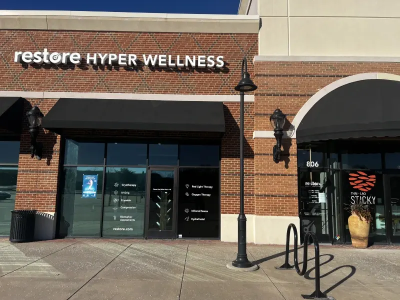 Restore Hyper Wellness storefront, suite 806, on a brick shopping-center facade in Murphy