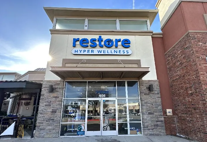Restore Hyper Wellness storefront, suite 1035, with stone facade and glass entrance in Plano