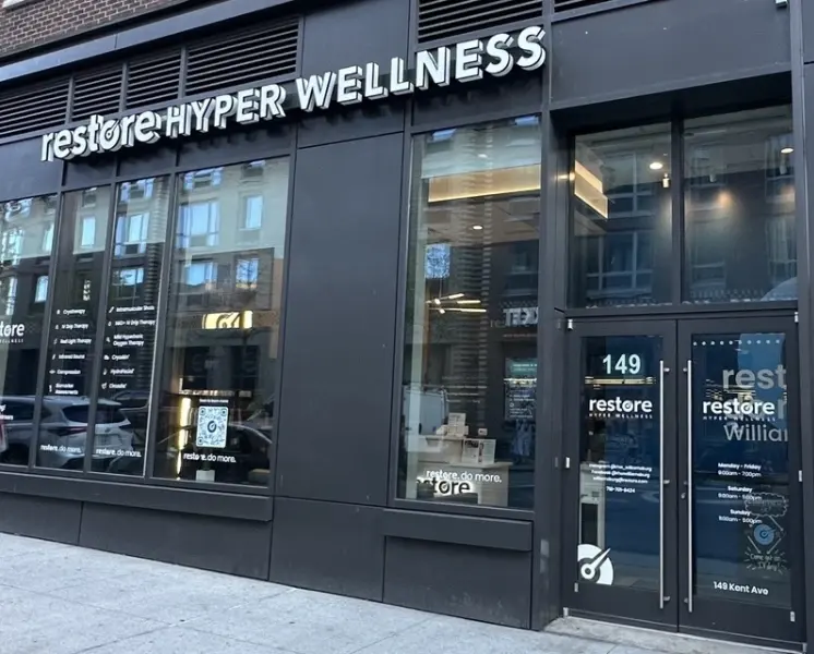 Restore Hyper Wellness storefront with glass frontage and signage in Williamsburg