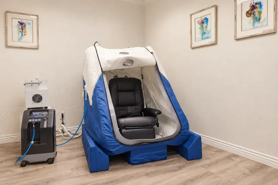 Soft hyperbaric chamber with recliner and oxygen concentrator at SoRay Hyperbarics